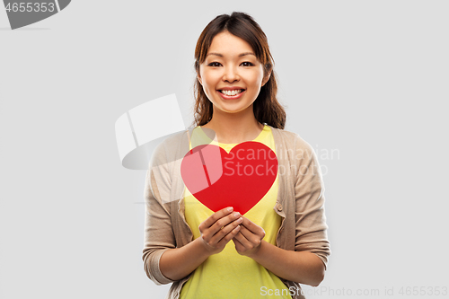 Image of happy asian woman with red heart