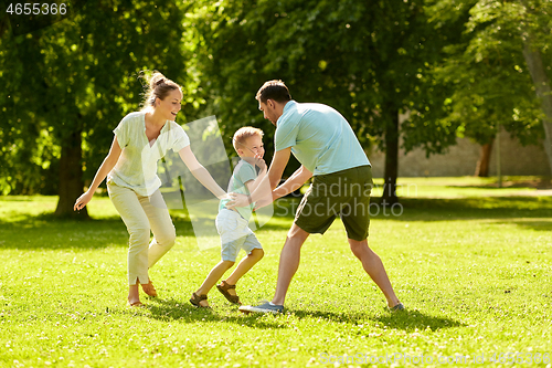 Image of happy family playing at summer park