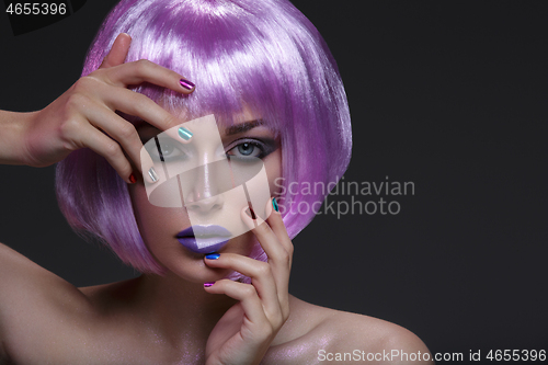 Image of Beautiful girl in purple wig