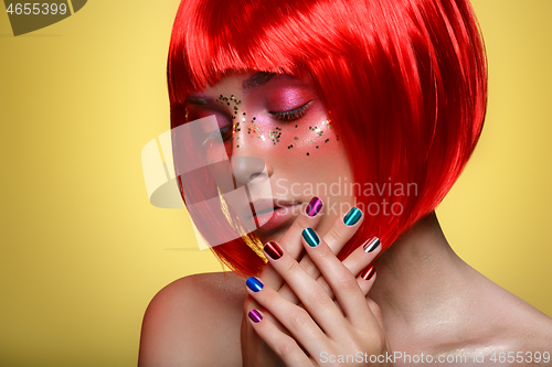 Image of Beautiful girl in red wig