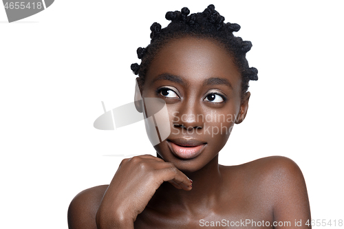 Image of Beautiful black girl touching face
