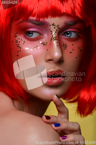 Image of Beautiful girl in red wig