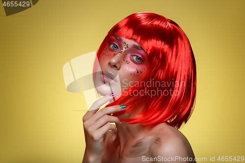 Image of Beautiful girl in red wig