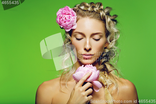 Image of Beautiful girl with peony flower