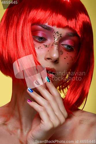 Image of Beautiful girl in red wig