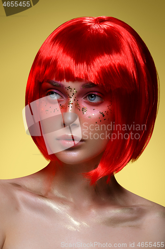 Image of Beautiful girl in red wig