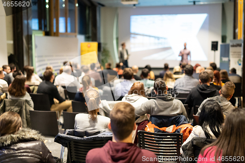 Image of Business speaker giving a talk at business conference event.