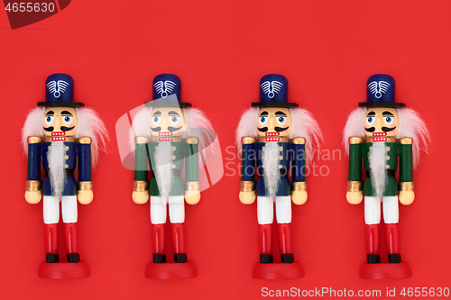 Image of Christmas Nutcracker Toy Soldiers on Red Background 