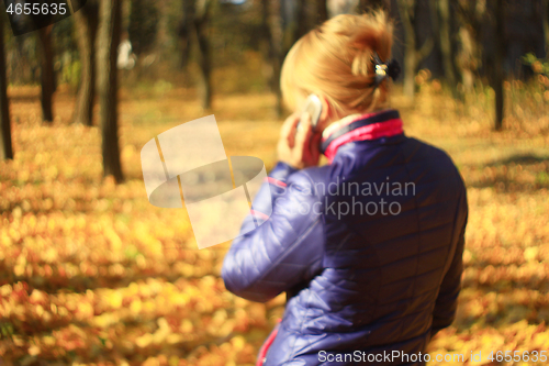 Image of modern woman talking on a cell phone