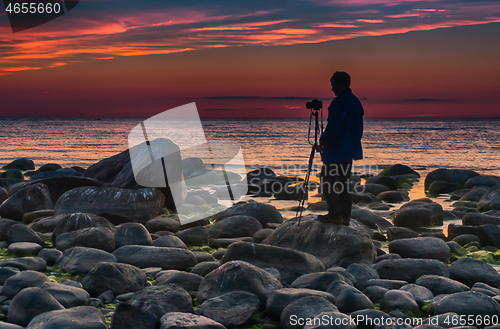 Image of Photographer near baltic sea sunset