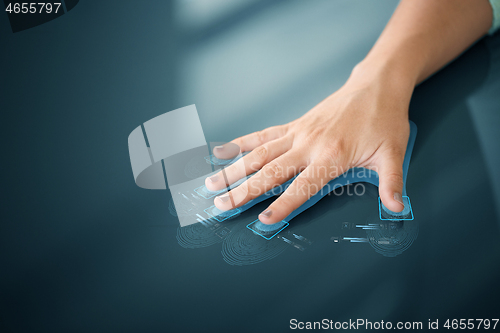 Image of hand on touch screen scanning fingerprints