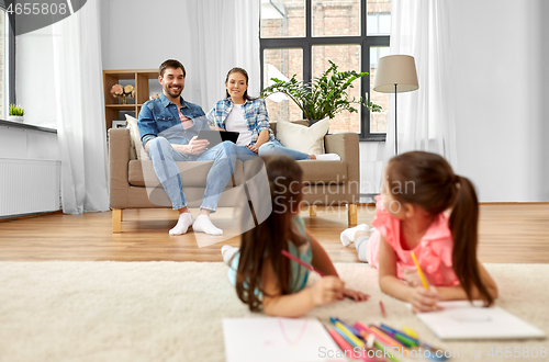 Image of happy family spending free time at home