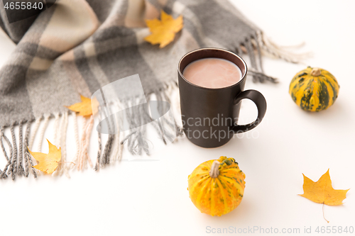 Image of hot chocolate, autumn leaves and warm blanket