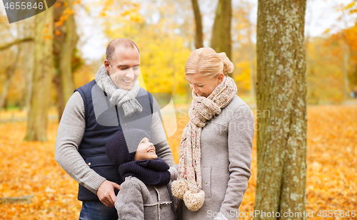 Image of happy family in autumn park