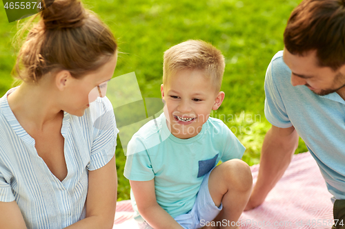 Image of happy family at summer park