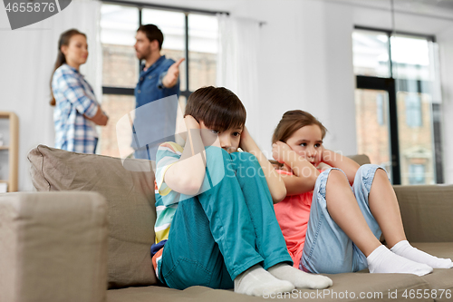 Image of sad children and parents quarreling at home