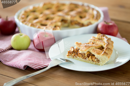 Image of close up of apple pie and fork on plate