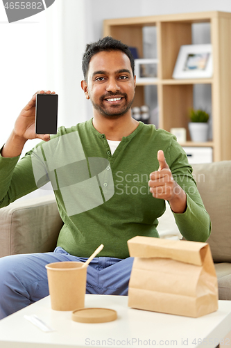 Image of indian man using smartphone for food delivery