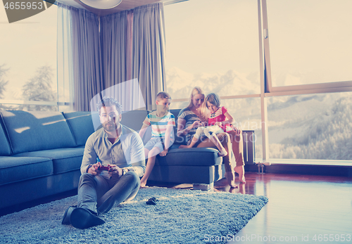 Image of Happy family playing a video game