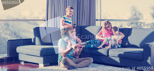 Image of Happy family playing a video game