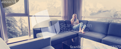 Image of young girl enjoying music through headphones