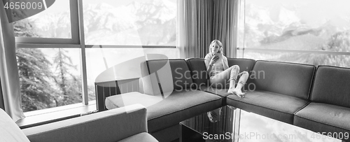 Image of young girl enjoying music through headphones