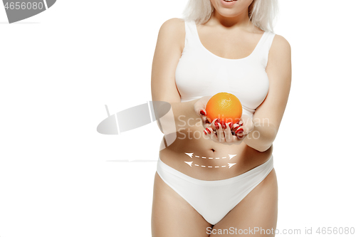 Image of Female body with the drawing arrows. Fat lose, liposuction and cellulite removal concept