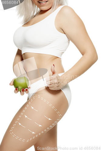Image of Female body with the drawing arrows. Fat lose, liposuction and cellulite removal concept