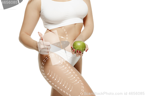 Image of Female body with the drawing arrows. Fat lose, liposuction and cellulite removal concept