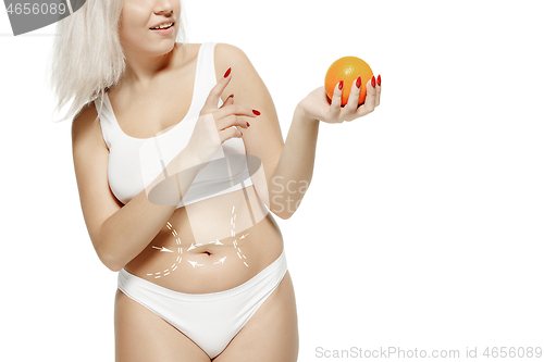 Image of Female body with the drawing arrows. Fat lose, liposuction and cellulite removal concept