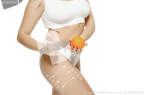 Image of Female body with the drawing arrows. Fat lose, liposuction and cellulite removal concept