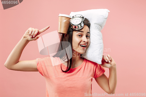 Image of Tired woman at home having too much work. Bored businesslady with pillow and coffee