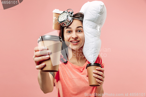 Image of Tired woman at home having too much work. Bored businesslady with pillow and coffee