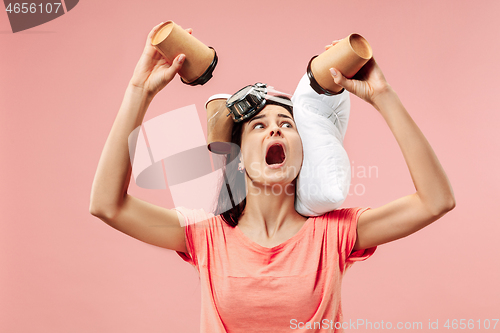 Image of Tired woman at home having too much work. Bored businesslady with pillow and coffee