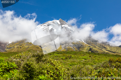 Image of volcano Taranaki covered in clouds, New Zealand 