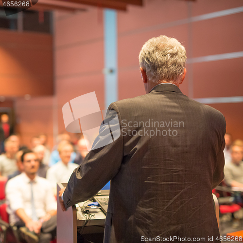 Image of Speaker at Business Conference and Presentation.