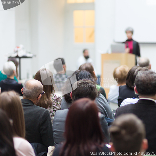 Image of Woman giving presentation on business conference.