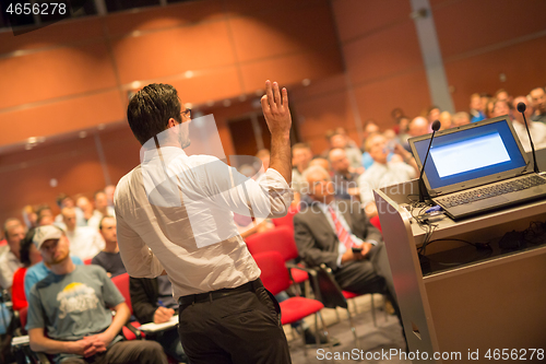 Image of Speaker at Business Conference and Presentation.