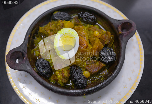 Image of Tajine with meat and prunes in pottery