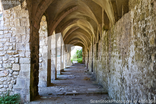 Image of Ancient alley with brick archts in old town.