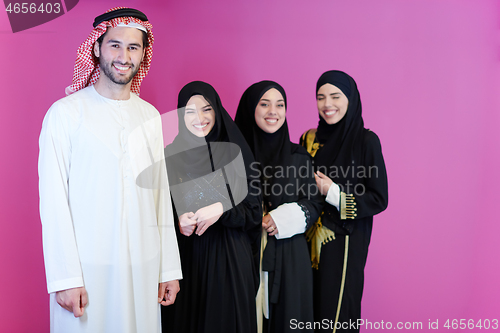 Image of portrait of young muslim people isolated on pink