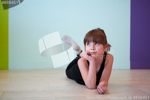 Image of girl having fun and dancing wearing mothers jewelry