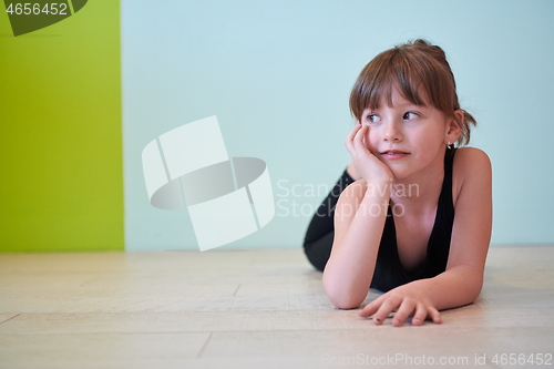 Image of girl having fun and dancing wearing mothers jewelry