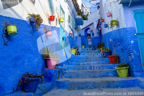 Image of Blue street with color pots in Chefchaouen