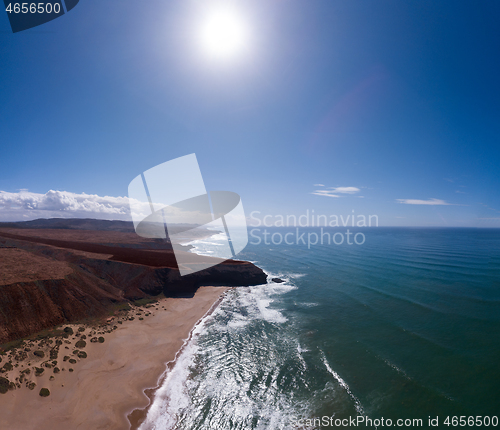 Image of Aerial view on ocean waves and rocks