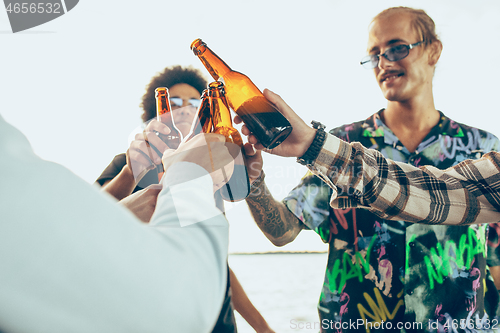 Image of Group of friends celebrating, resting, having fun and party in summer day