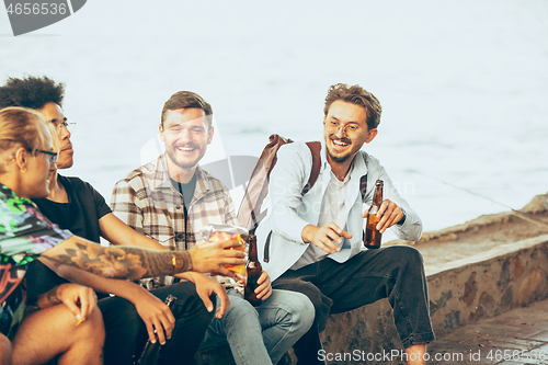 Image of Group of friends celebrating, resting, having fun and party in summer day