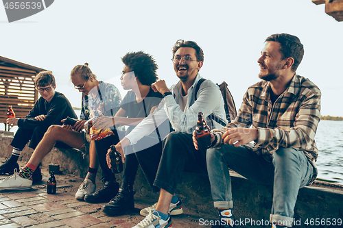 Image of Group of friends celebrating, resting, having fun and party in summer day