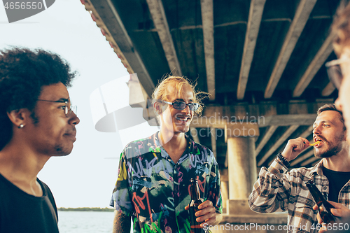 Image of Group of friends celebrating, resting, having fun and party in summer day