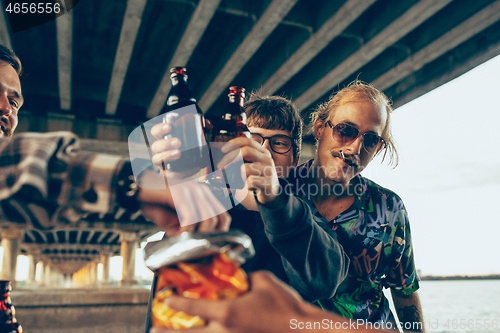 Image of Group of friends celebrating, resting, having fun and party in summer day